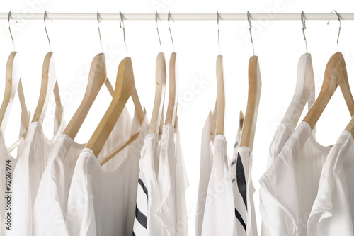 white clothes on hangers close up