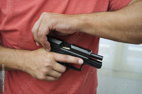 Man load a gun pistol