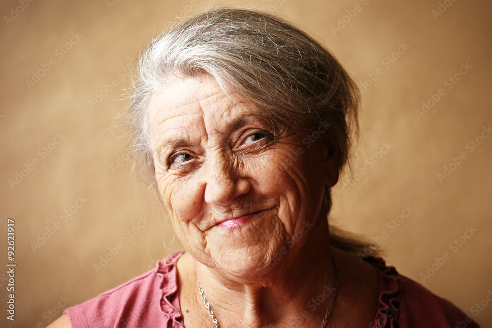 Smile granny face on a brown background Smile granny face on a brown background