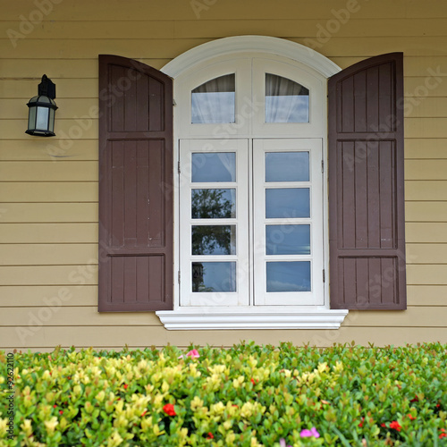 vintage window on wooden wall