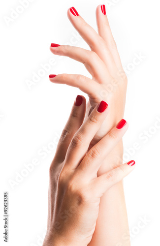 Closeup photo of a female hands with red nails