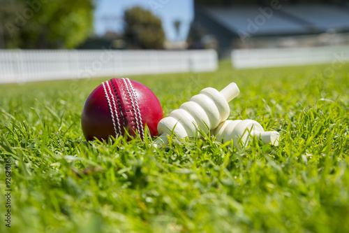Cricket ball and bails on the field