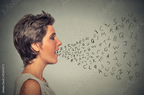 woman talking with alphabet letters coming out of her mouth