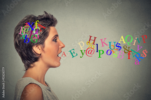 Εκτύπωση καμβά woman talking with alphabet letters in her head coming out of open mouth