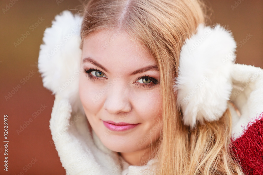 Portrait of pretty gorgeous woman in earmuffs. Portrait of pretty gorgeous woman in earmuffs.