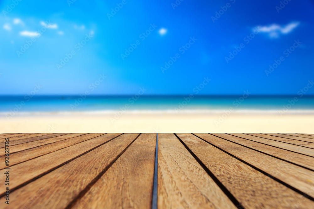 Top of teak wood table and view of sea and blue sky