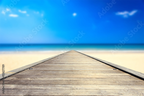 Wooden bridge or walkway and tropical beach