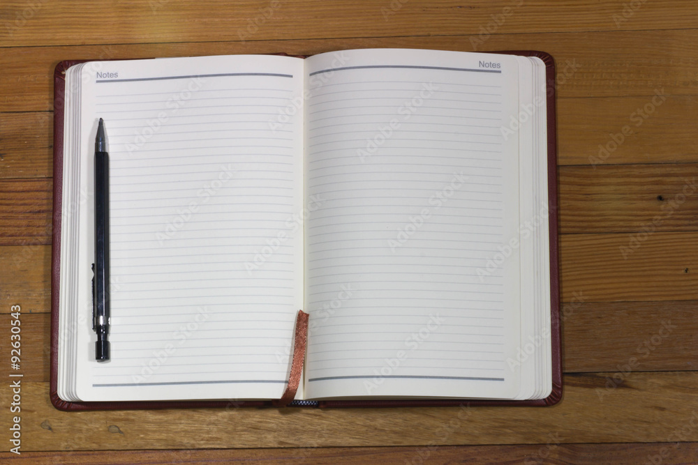 blank notebook on wooden table, business concept