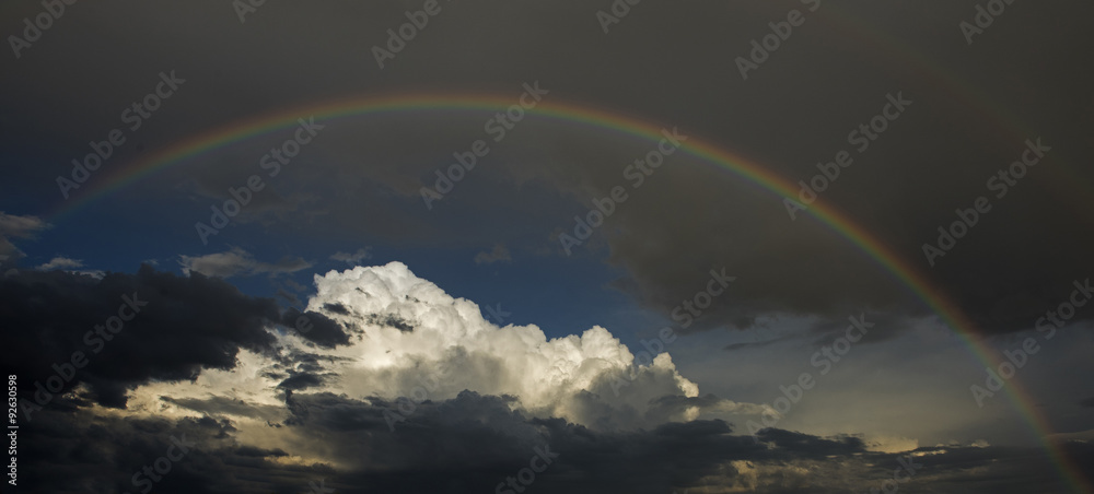 rainbow over storn clouds rainbow over storn clouds