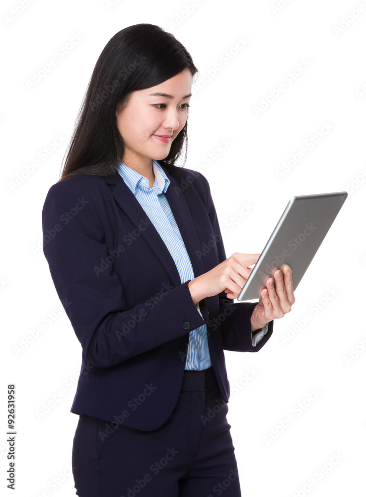 Beautiful Businesswoman use of the tablet pc Beautiful Businesswoman use of the tablet pc