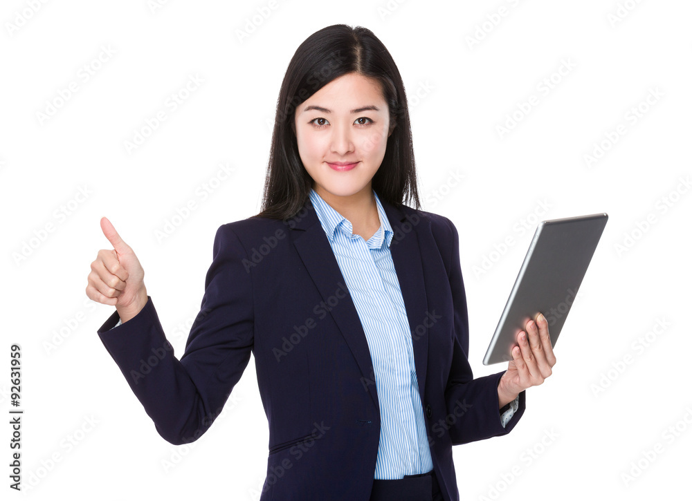 Businesswoman use of the tablet pc and thumb up Businesswoman use of the tablet pc and thumb up