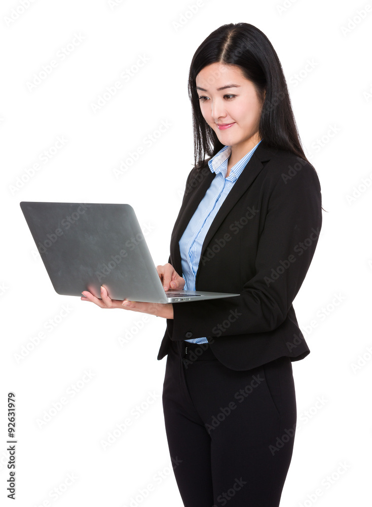 Asian businesswoman use of the laptop computer Asian businesswoman use of the laptop computer