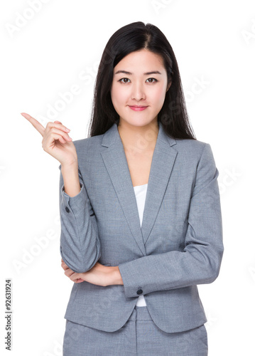 Asian young businesswoman with finger point up