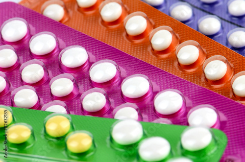 Colorful oral contraceptive pill strips.
