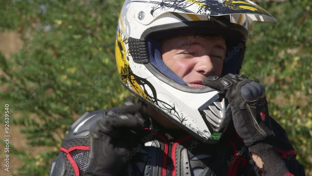 Face of young racer in motorcycle protective gear closeup Face of young racer in motorcycle protective gear closeup