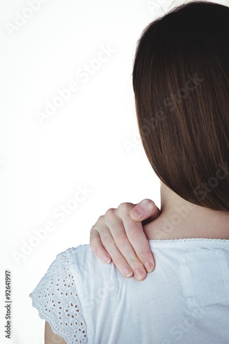 Woman touching her sore shoulder