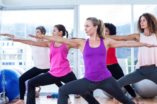 Women exercising with arms outstretched 