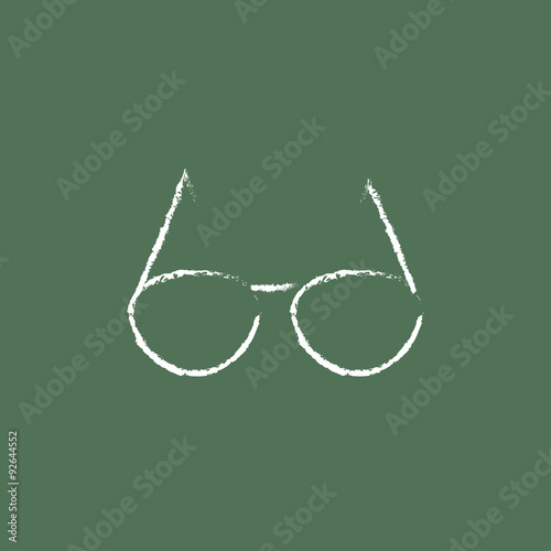 Eyeglasses icon drawn in chalk.