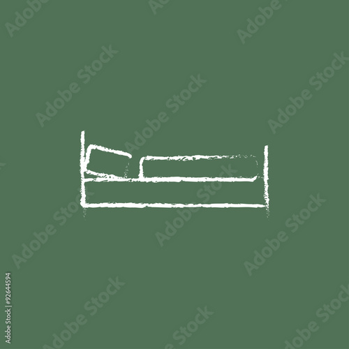 Bed icon drawn in chalk.