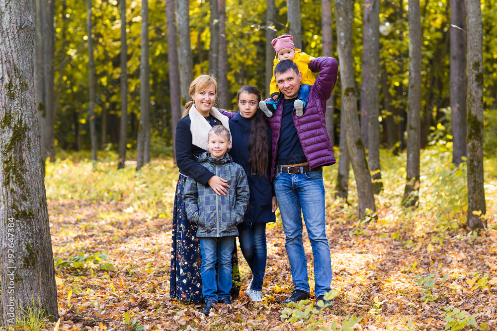 cute family in  a park on an autumn