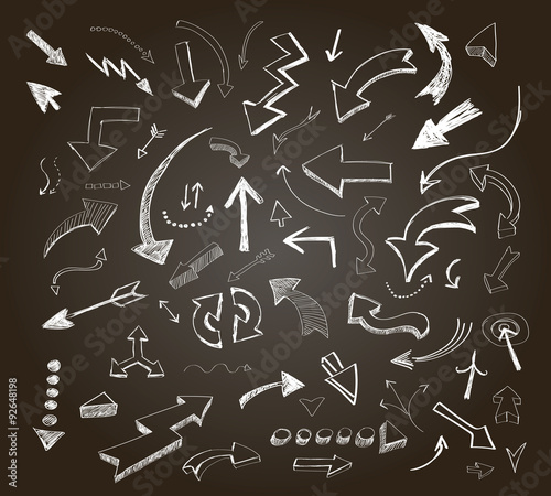 Hand drawn arrows icons set on a chalkboard 