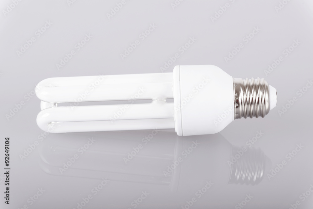 Energy efficient light bulb on gray background Energy efficient light bulb on gray background