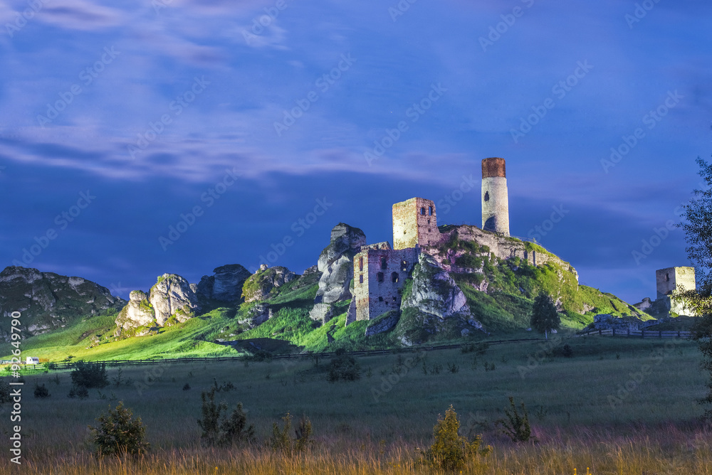 Night view ot the illuminated ruins of medieval castle in Poland