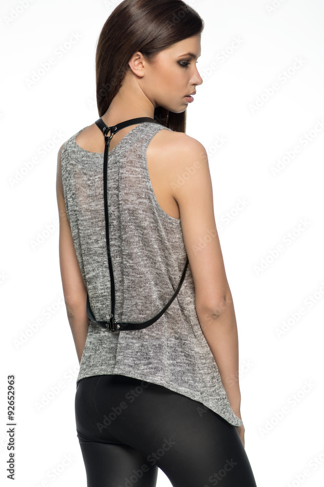 Naklejka premium Beautiful model in fashion clothes in studio