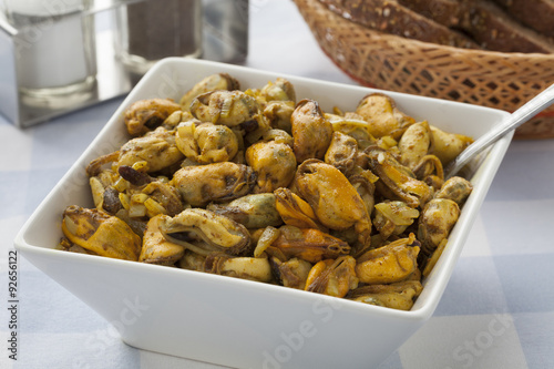 Dish with fresh baked mussels photo