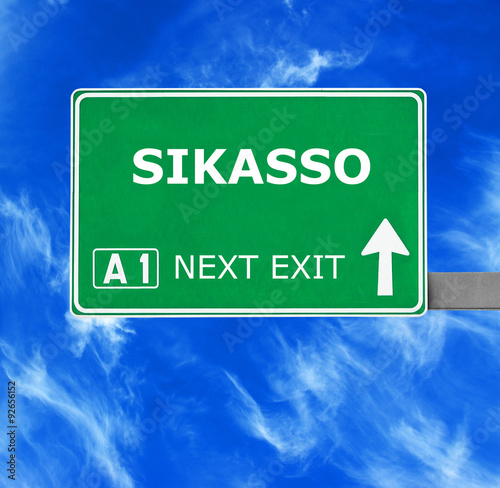 SIKASSO road sign against clear blue sky photo