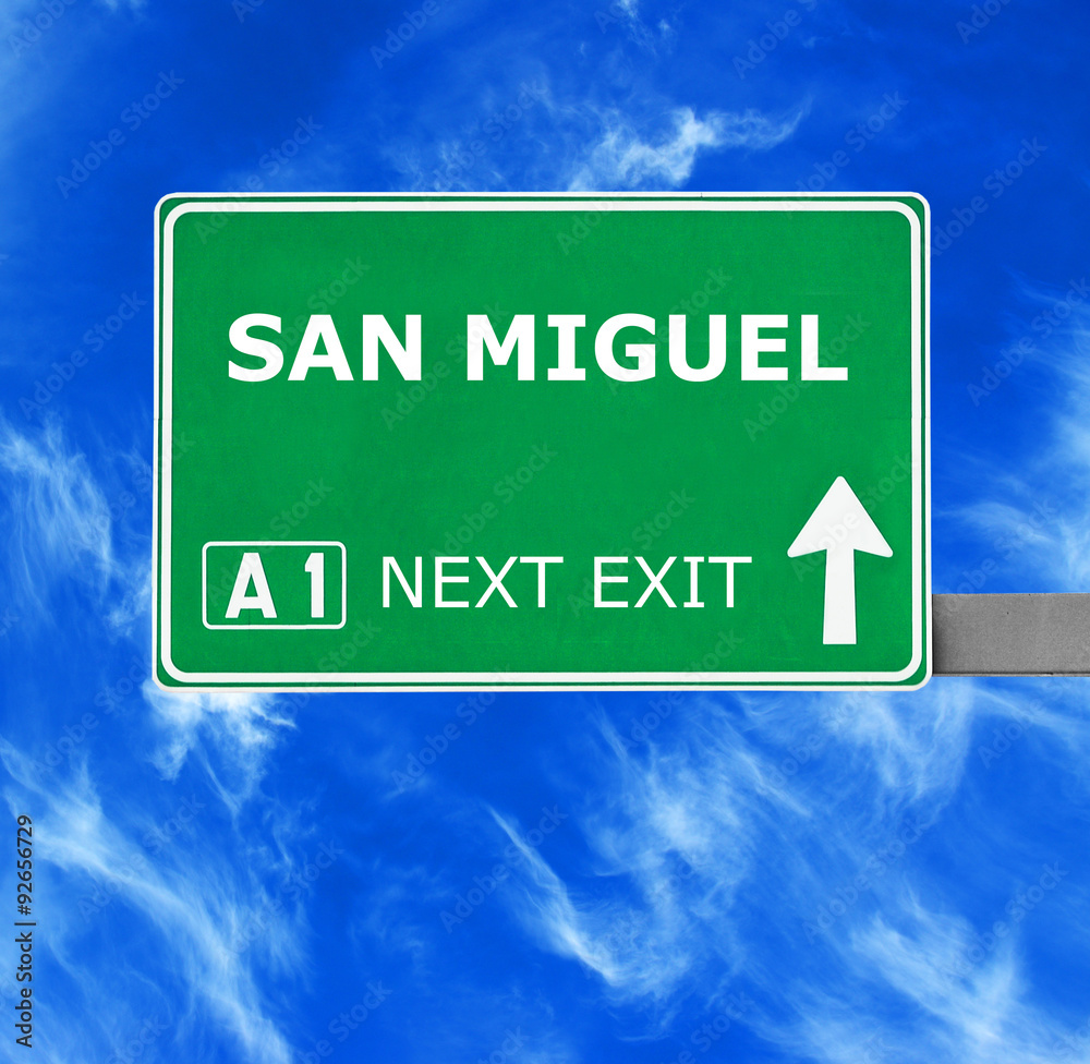 Naklejka premium SAN MIGUEL road sign against clear blue sky