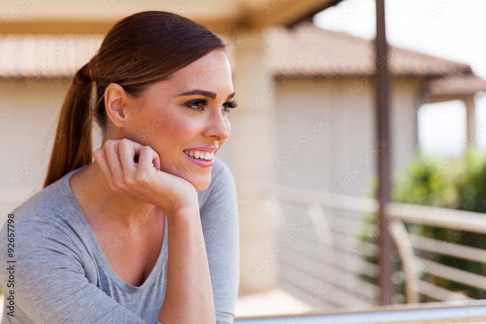 woman outdoors on a apartment balcony