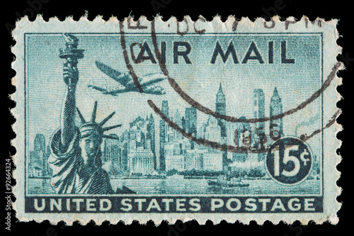 United States air mail postage stamp showing an airplane over New York Skyline and the Statue of Liberty