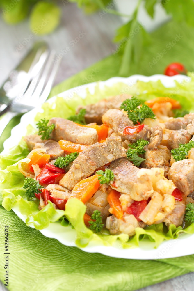 Warm salad with meat and fried vegetables Warm salad with meat and fried vegetables
