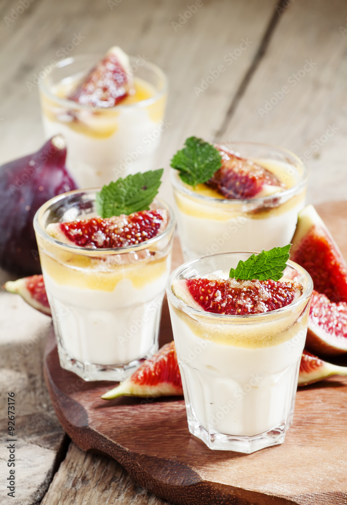 Creamy white yogurt with honey, figs and mint, selective focus Creamy white yogurt with honey, figs and mint, selective focus