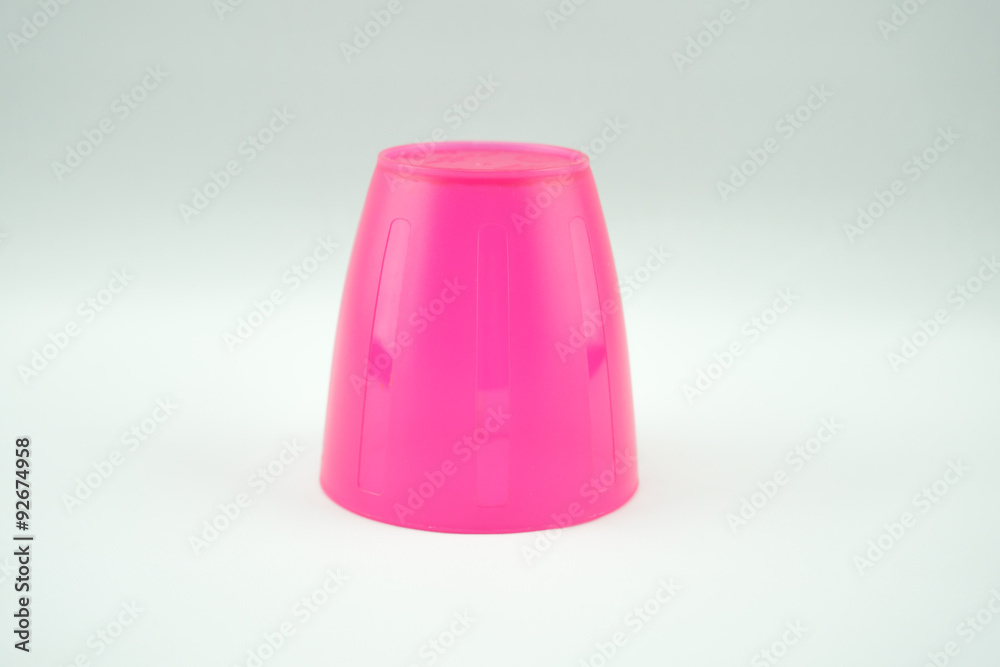 pink plastic mug on white background pink plastic mug on white background