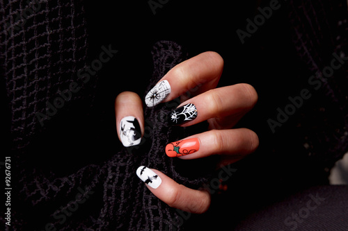 Manicured nails with halloween patterned nail polish