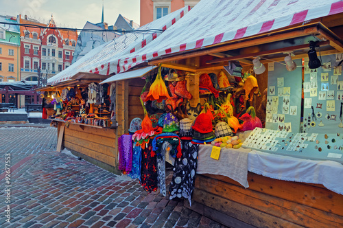 Obraz na plátně Christmas market stall in Riga with lovely souvenirs displayed f