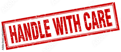 handle with care red square grunge stamp on white