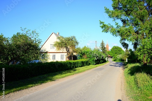 Fototapeta Naklejka Na Ścianę i Meble -  Road to the church in Viesintos town in Anyksciai district