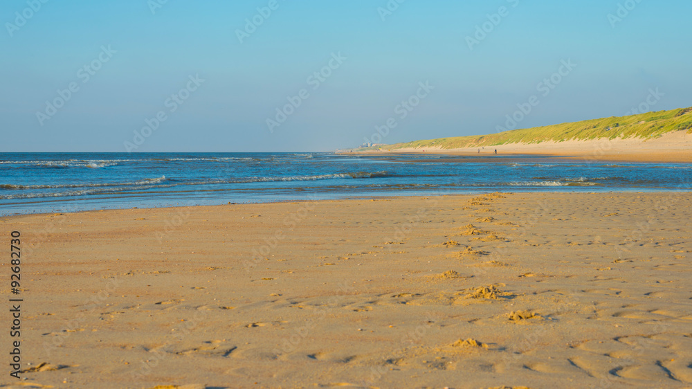Blue sky over a beach along the North Sea Blue sky over a beach along the North Sea