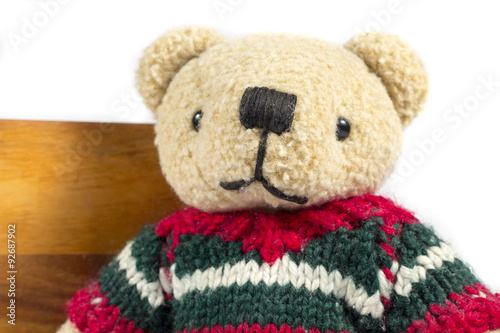 Close-up of teddy bear with wool coat