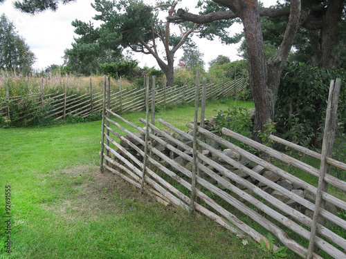 Traditional wood stick fence as house boundary in Falkenberg  Sweden.