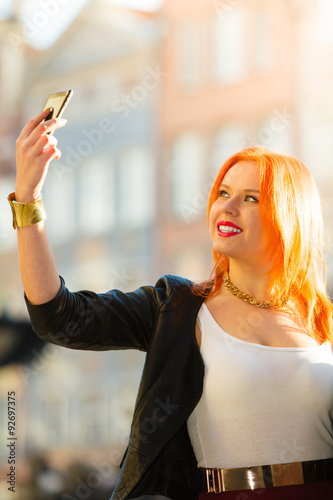 woman taking self picture with smartphone camera