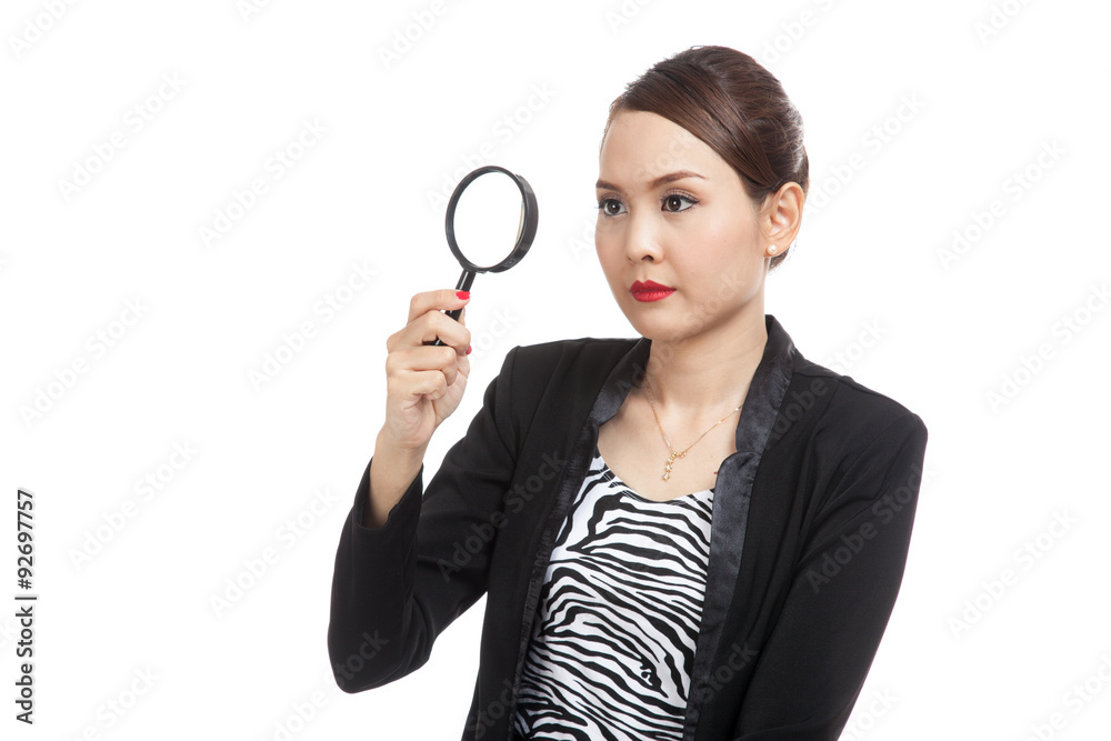 Young Asian business woman with a magnifying glass Young Asian business woman with a magnifying glass