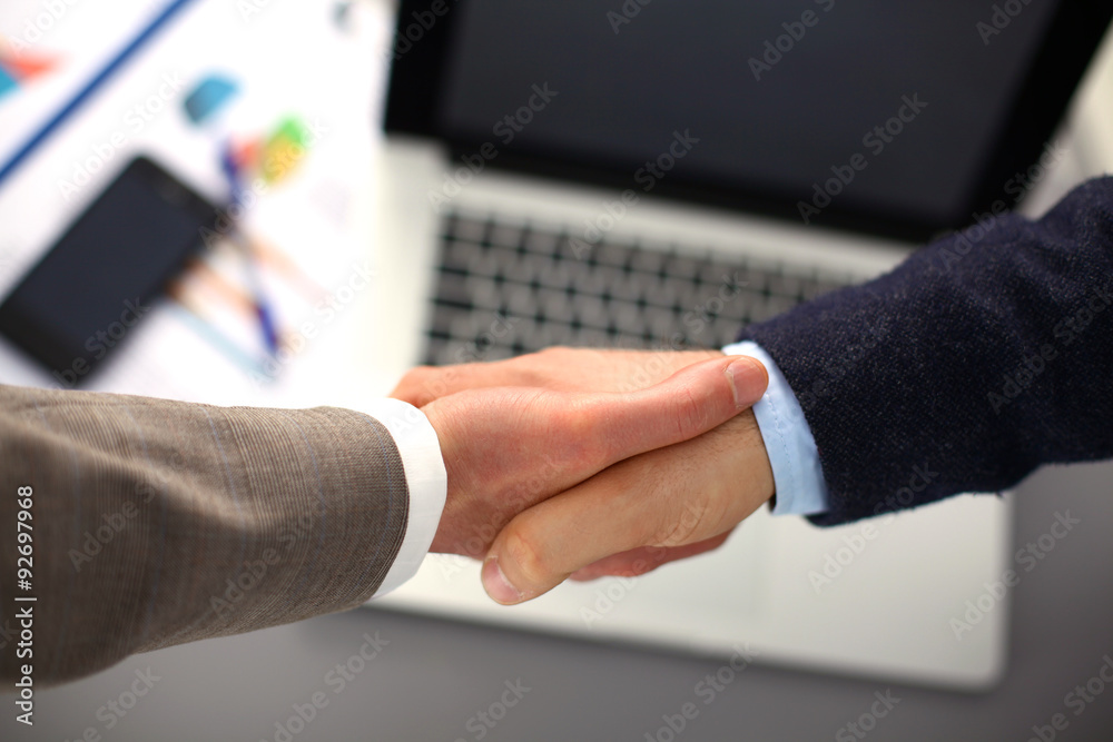 Business handshake. Two businessman shaking hands with each Business handshake. Two businessman shaking hands with each