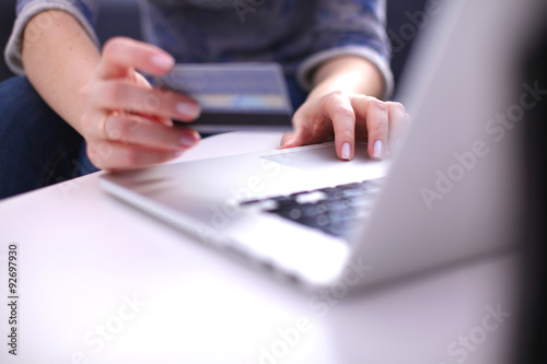 Young businesswoman working on a laptop © lenetsnikolai