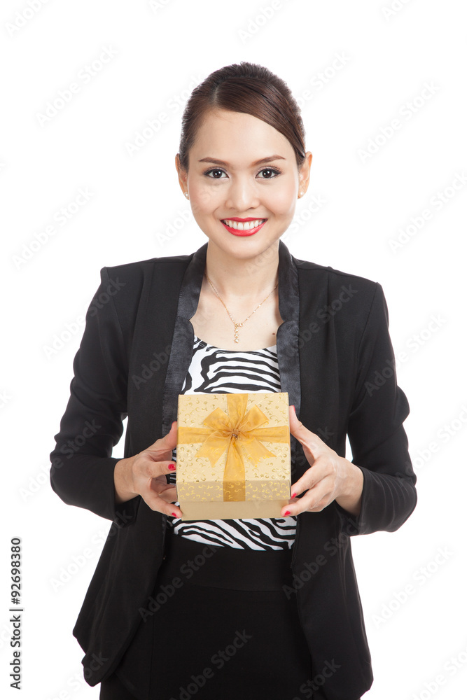 Young Asian business woman with a golden gift box Young Asian business woman with a golden gift box