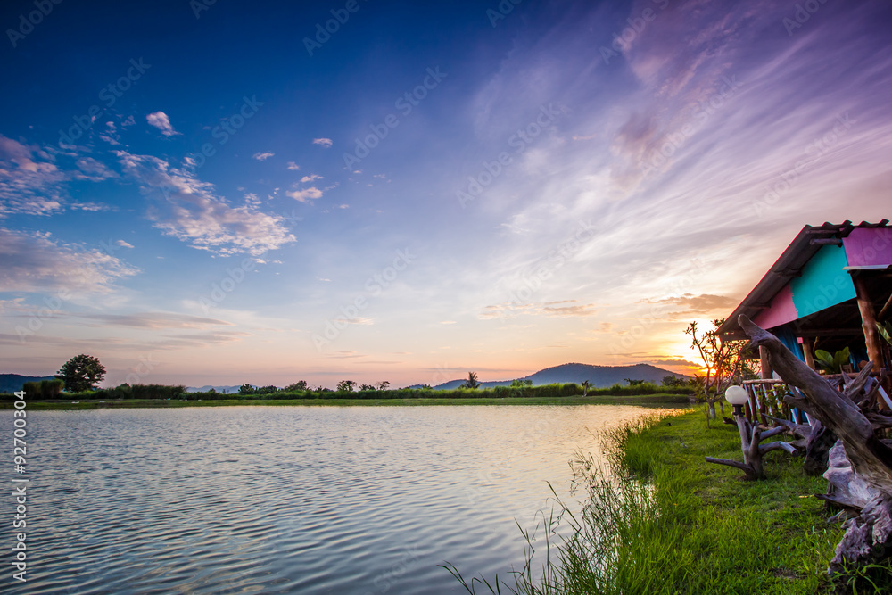 Fototapeta premium landscape with sunset over lake