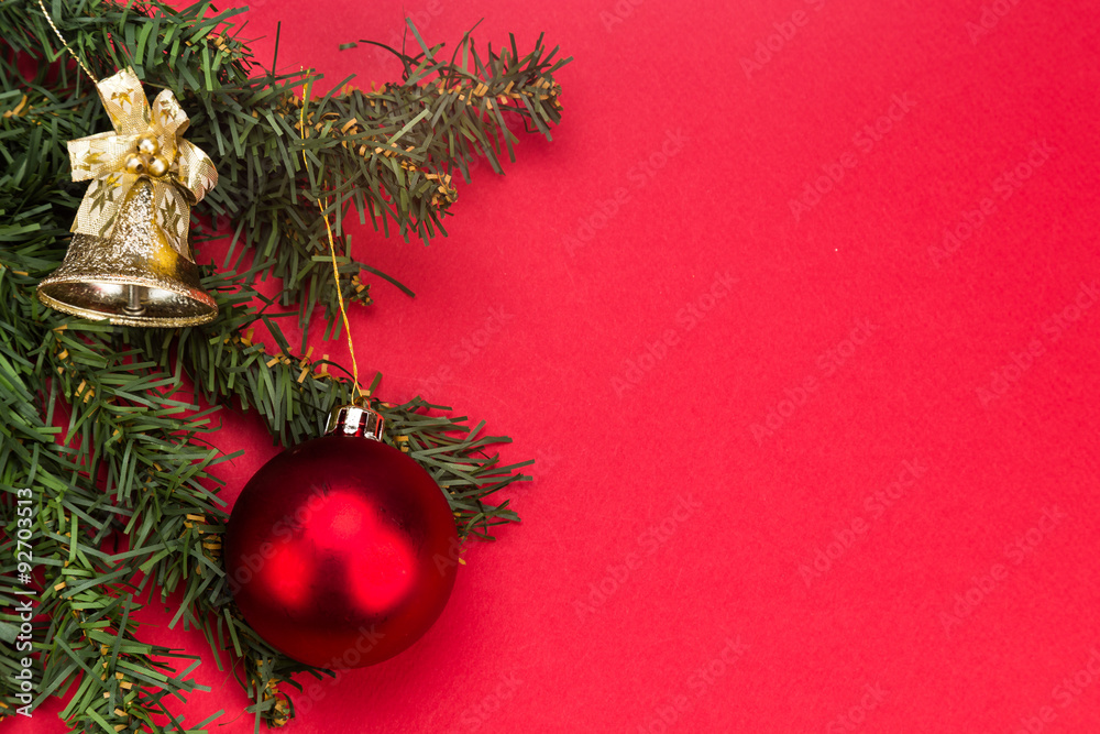 Simple red Christmas background with fir tree,  ornaments and bell
